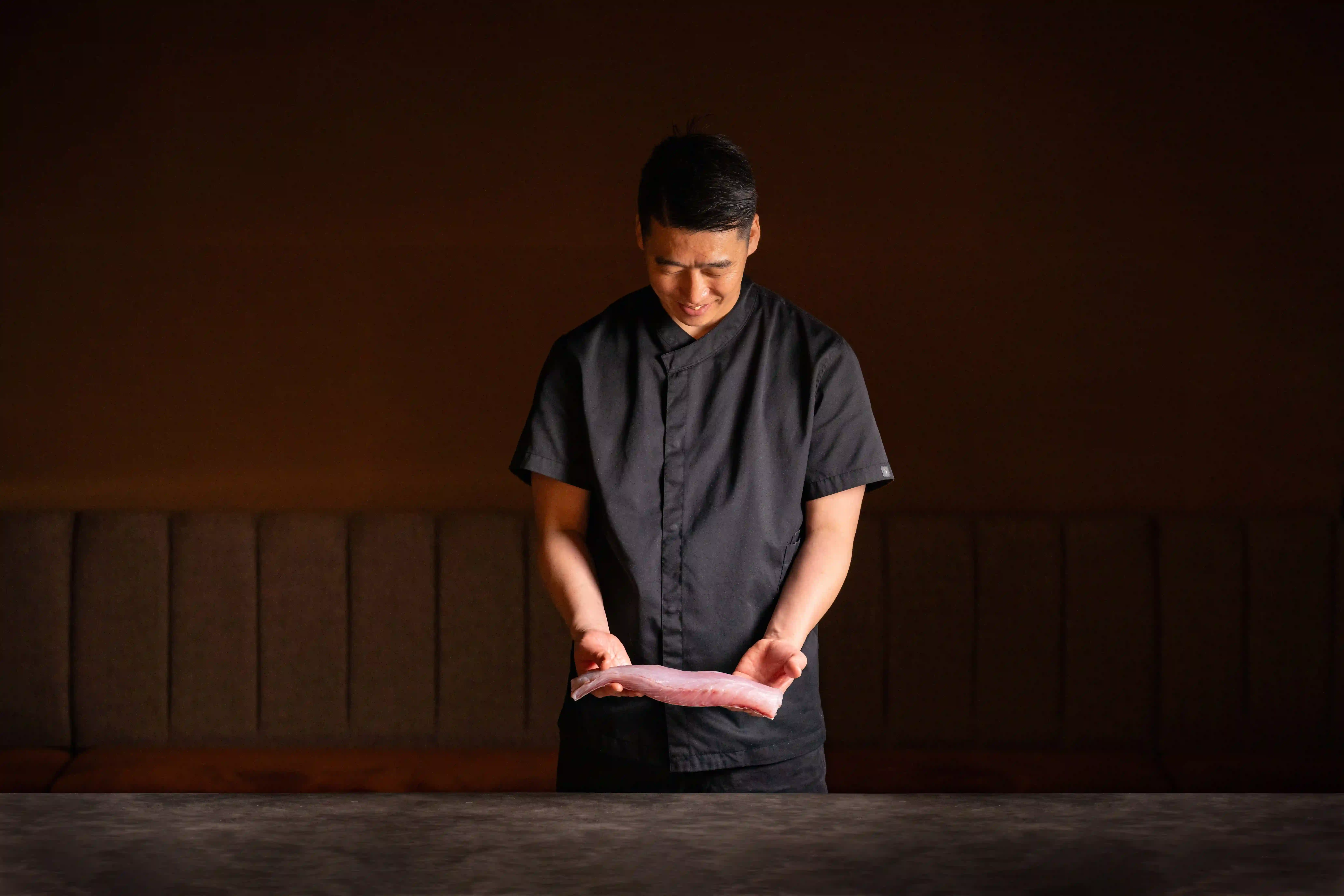Japanese sashimi chef prepares Opal Barramundi.